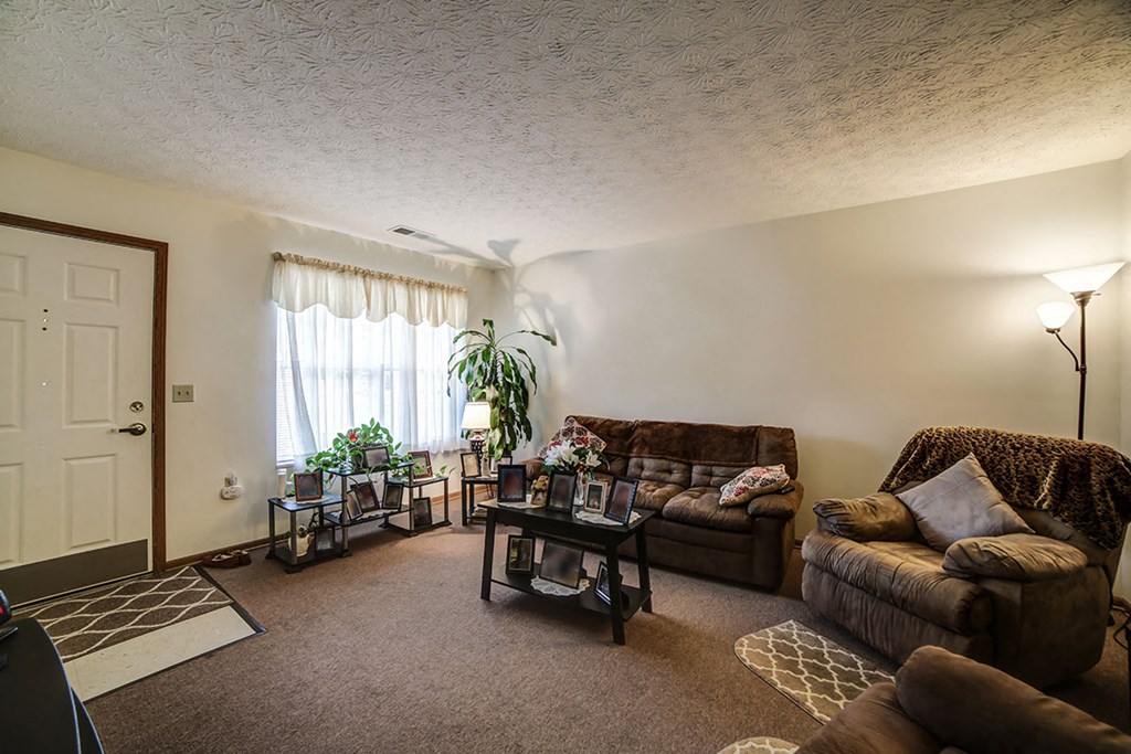 a living room with couches and a table