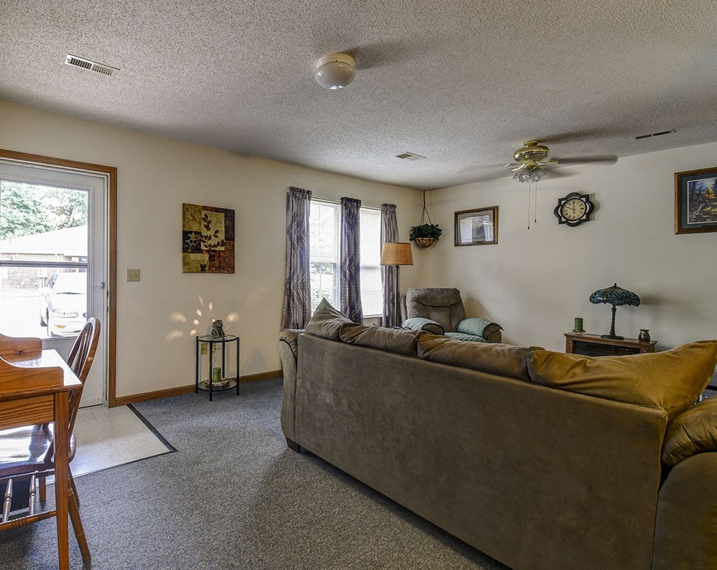 a living room with a couch and a table