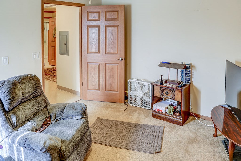 a living room with a couch and a tv