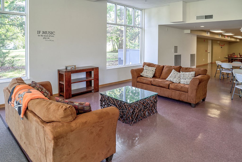 a living room with couches and a coffee table