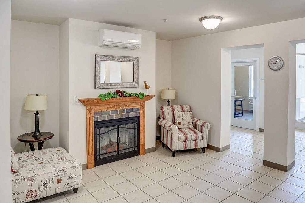 a living room with a fireplace and a couch