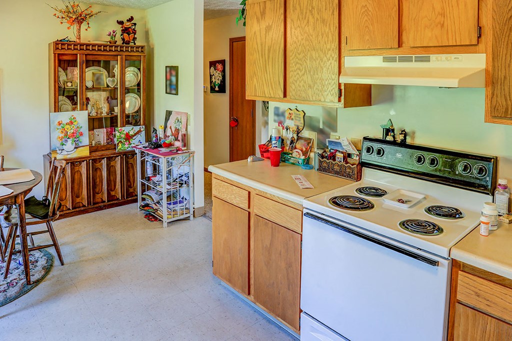 a kitchen with a stove and a counter top