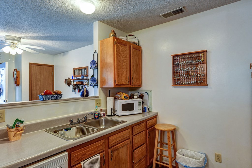 a kitchen with a sink and a counter top