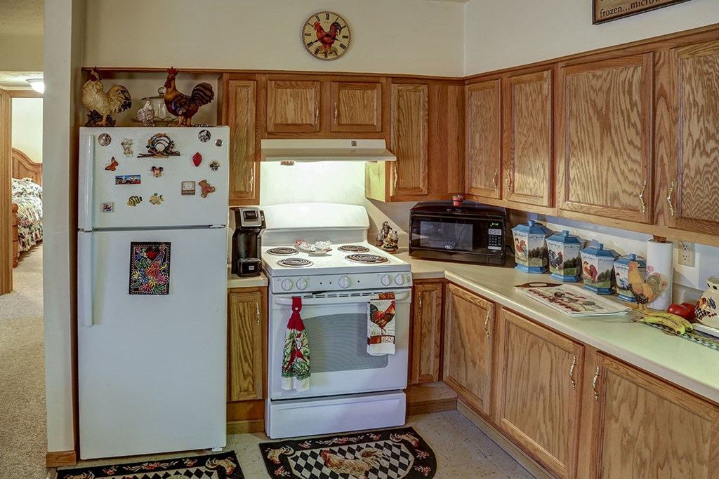 a kitchen with a stove and a refrigerator