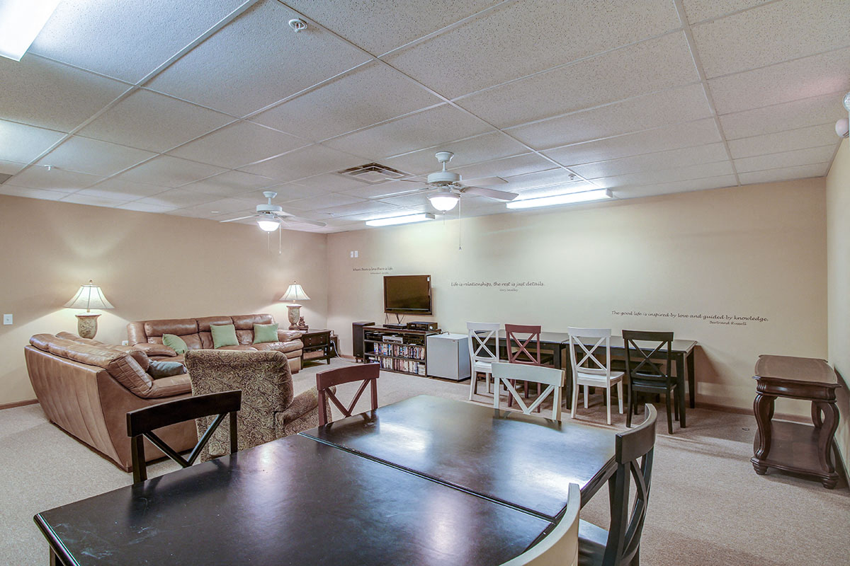 a living room with a table and a couch