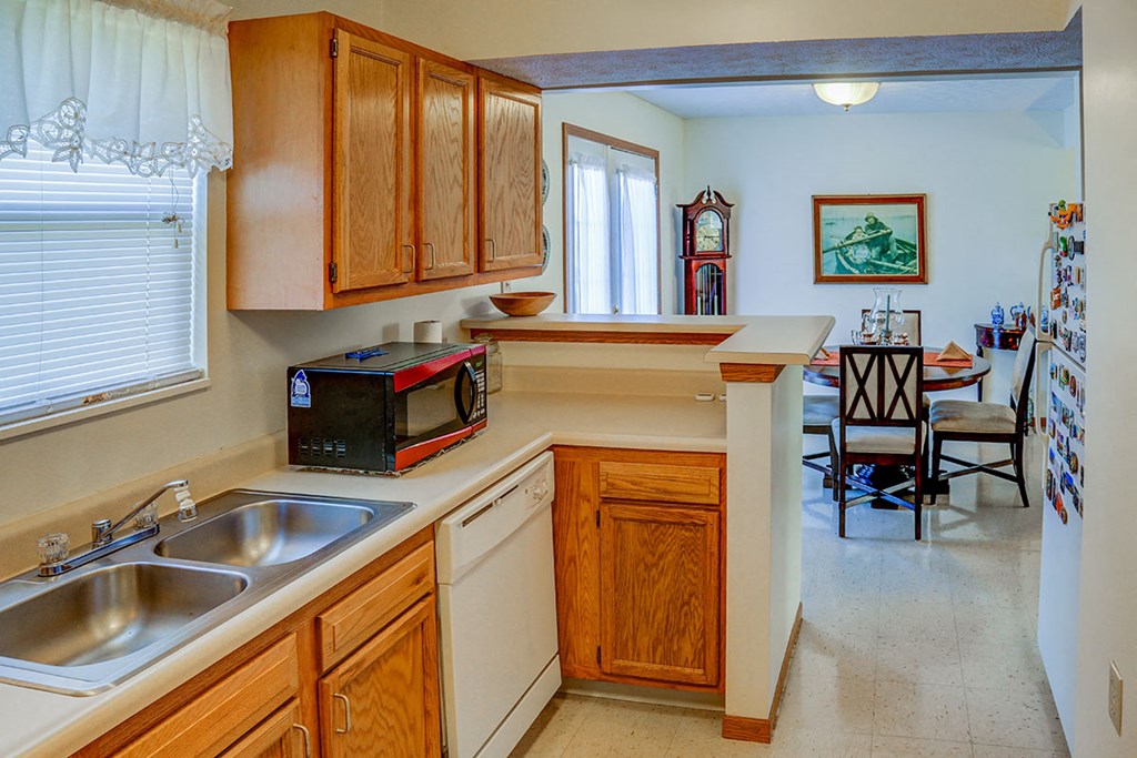a kitchen with a sink and a microwave