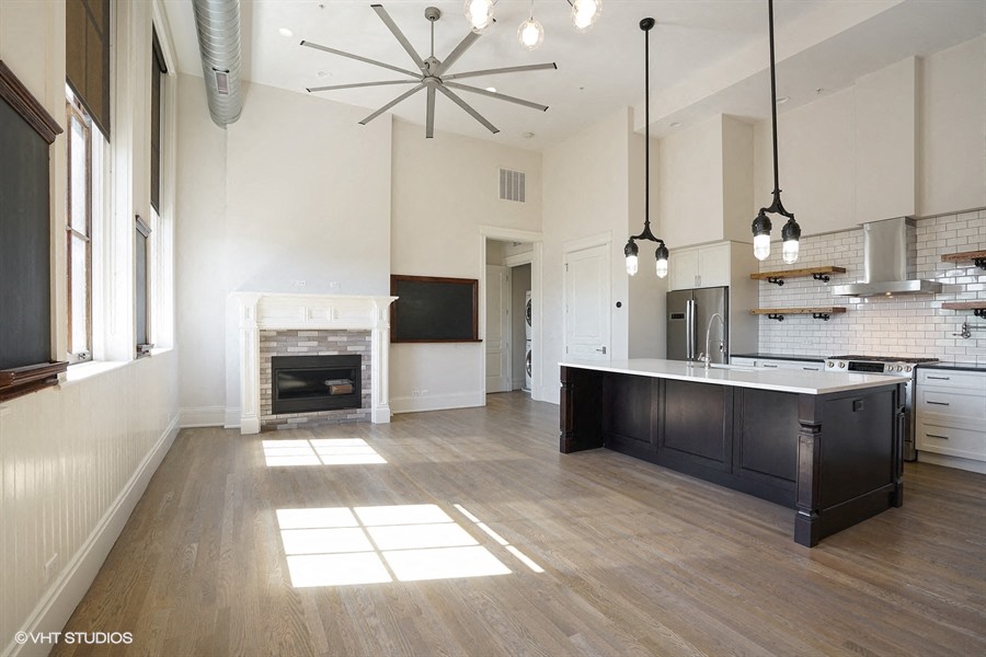 the kitchen is open to the living room and dining room