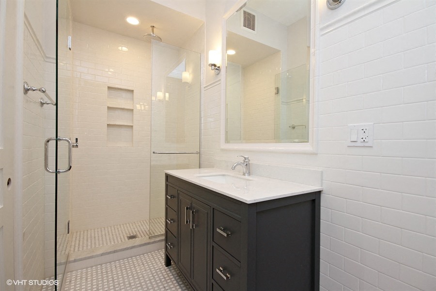 a bathroom with a sink and a shower