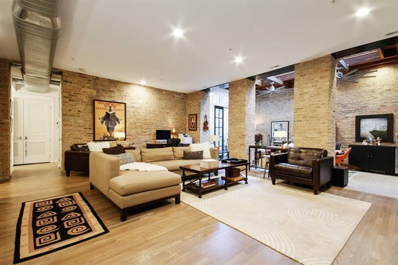 a living room filled with furniture and a fireplace