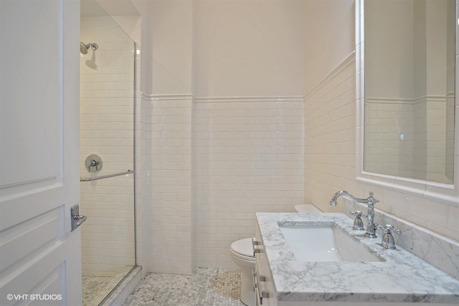 a bathroom with a sink and a toilet and a shower