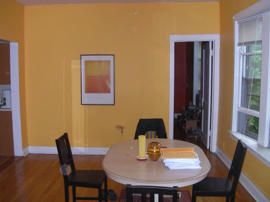 a dining room with a table and chairs