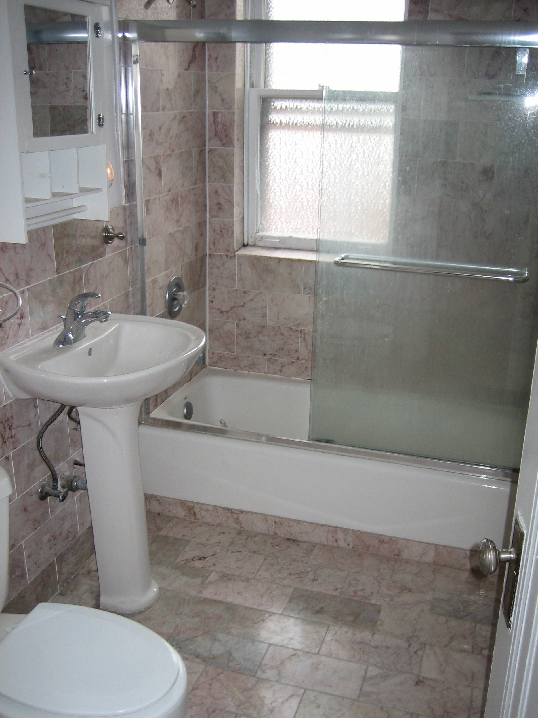 a bathroom with a sink and a tub and a toilet