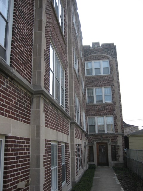 a tall brick building with a tower on top of it