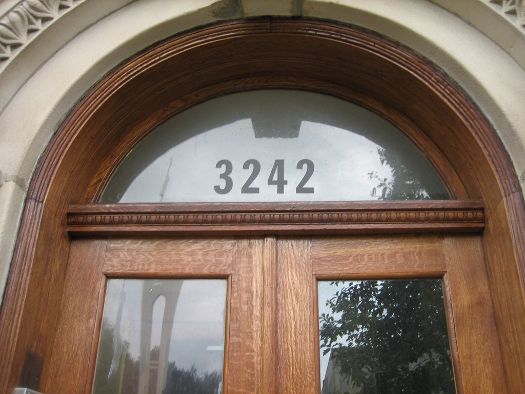 the number on the door of a building is displayed on the window