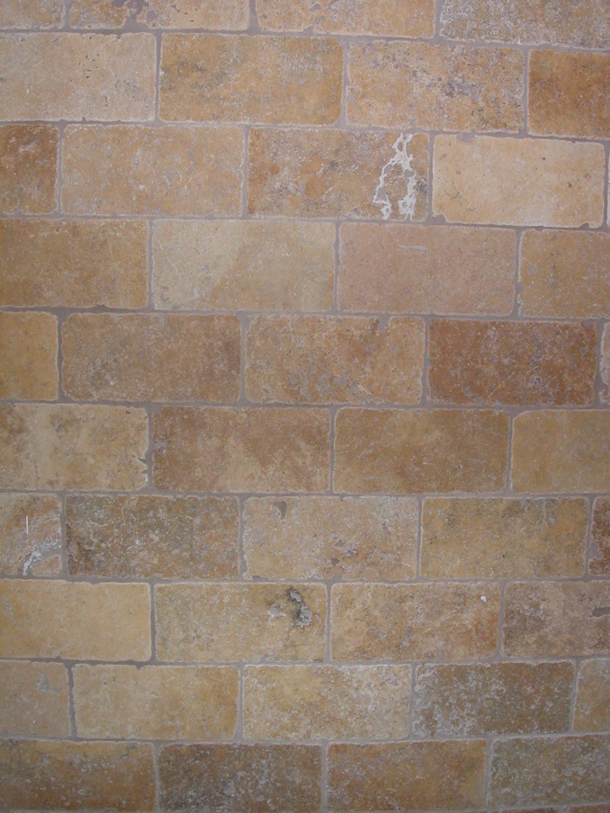 a close up of a brick wall with scratches