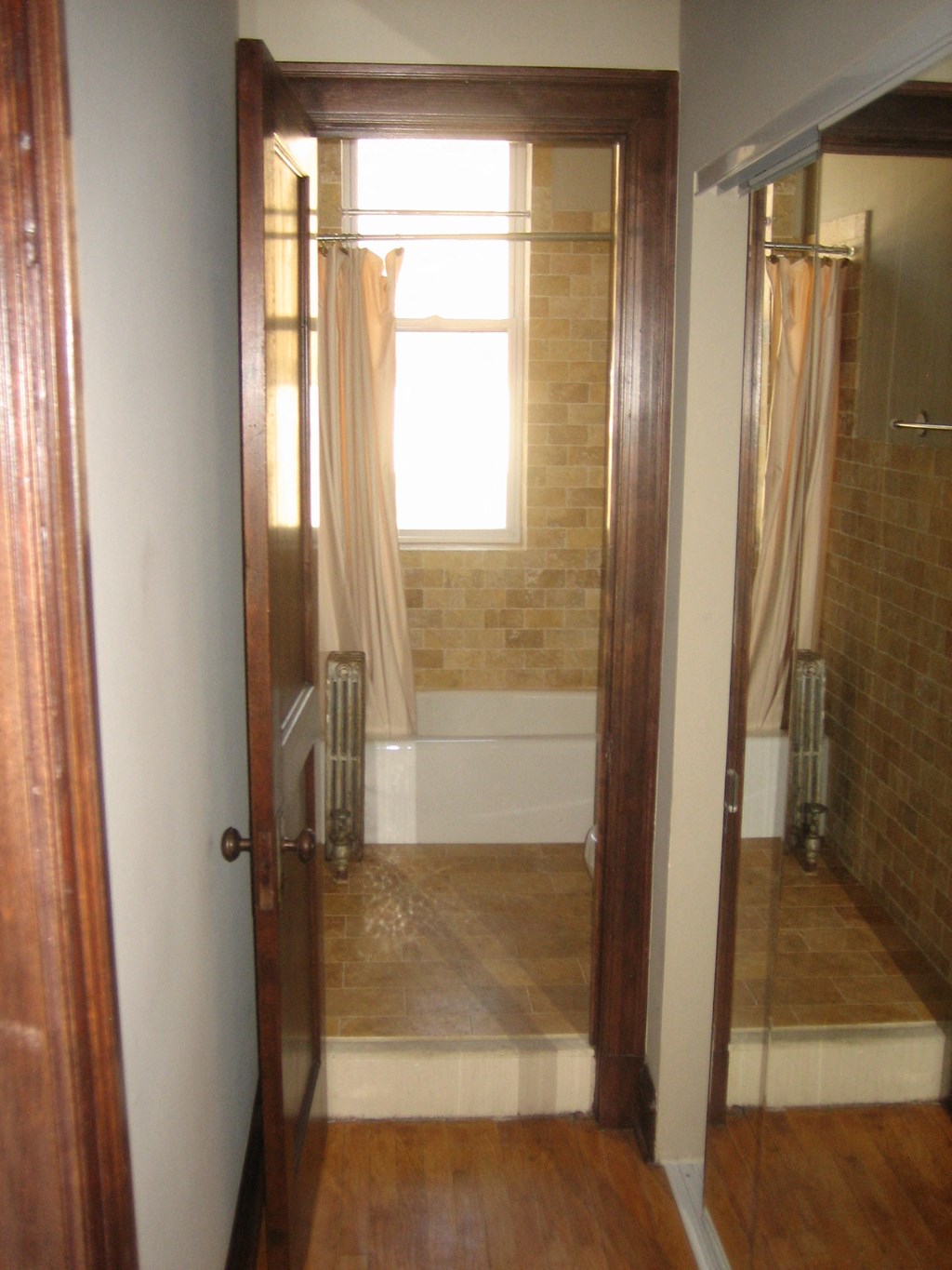 a bathroom with a shower and a window in it