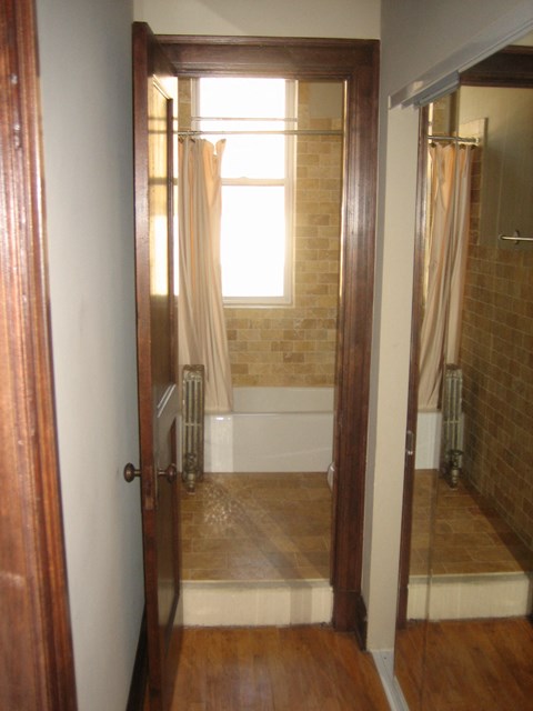 a bathroom with a shower and a window in it