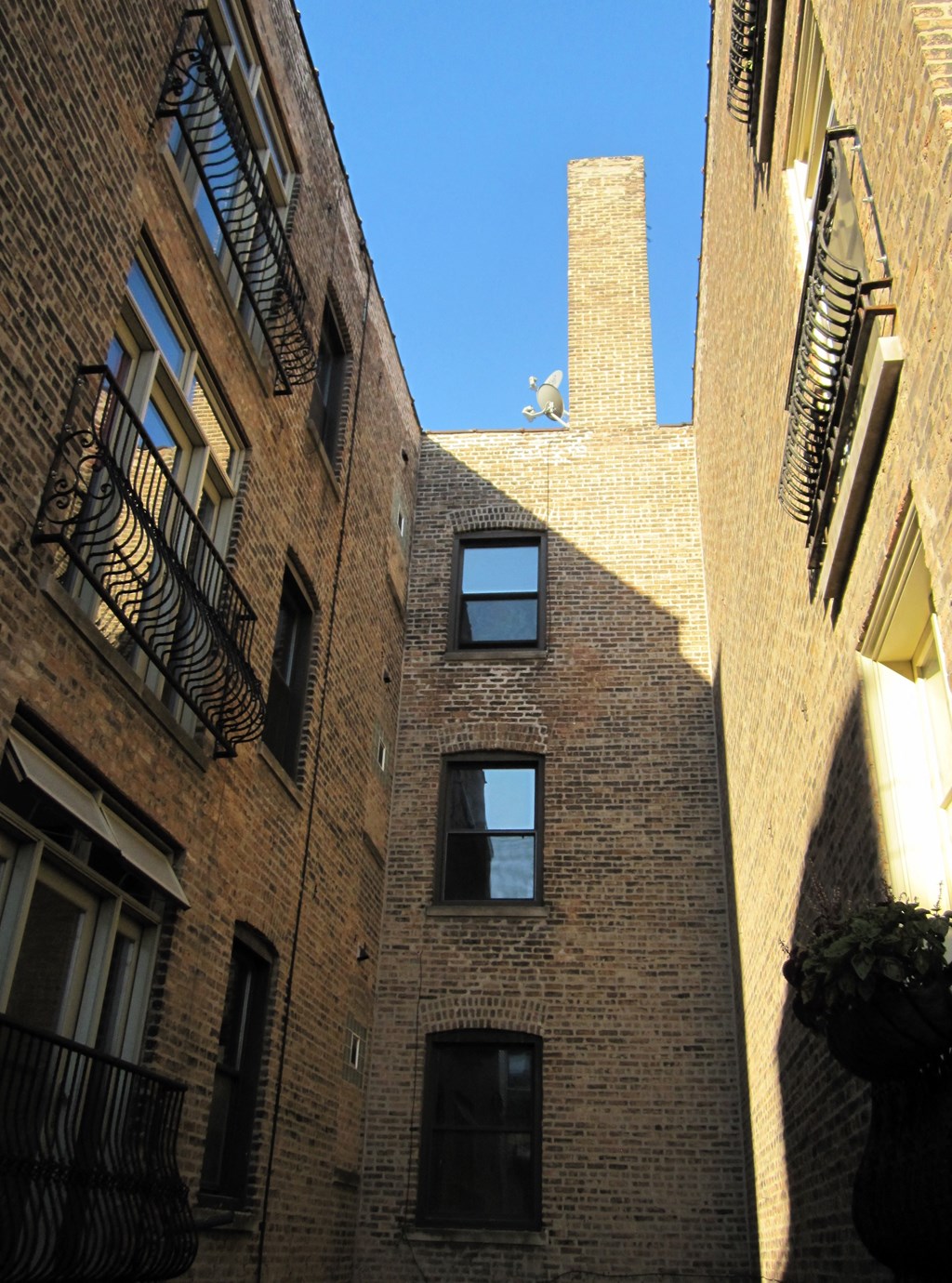 a brick building with a chimney on the side of it