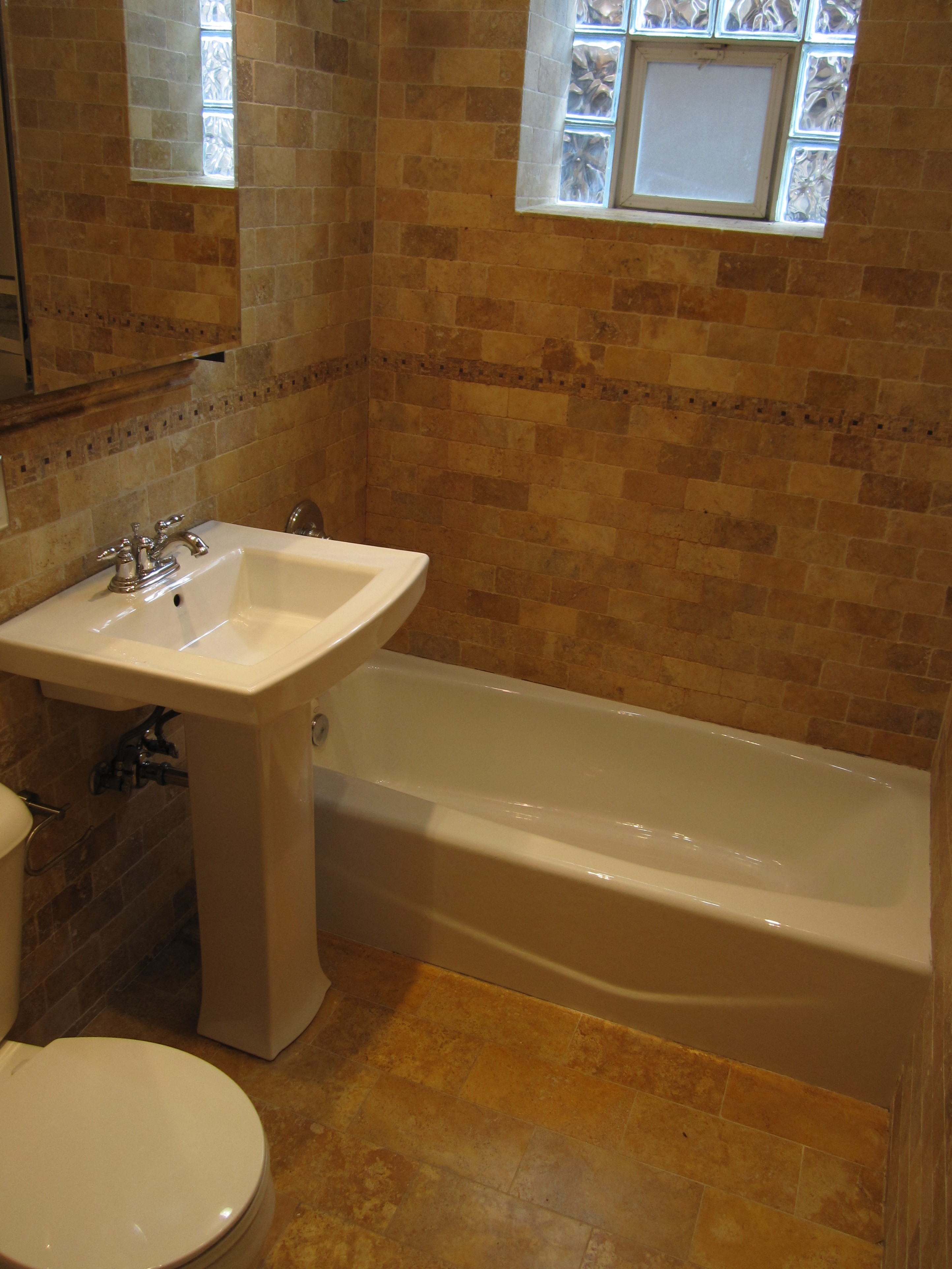 a bathroom with a sink and a tub and a toilet