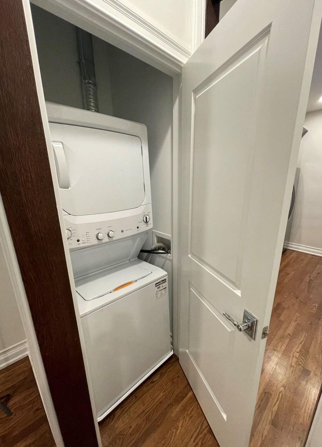 a small closet with a washer and dryer in it
