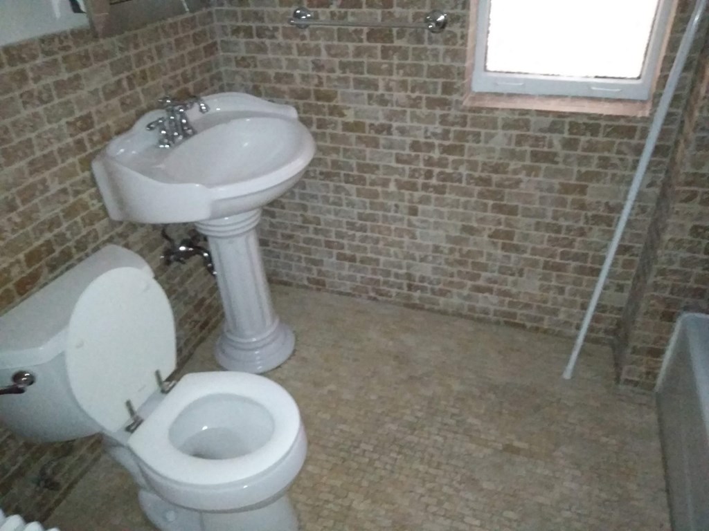 a bathroom with a toilet and a sink