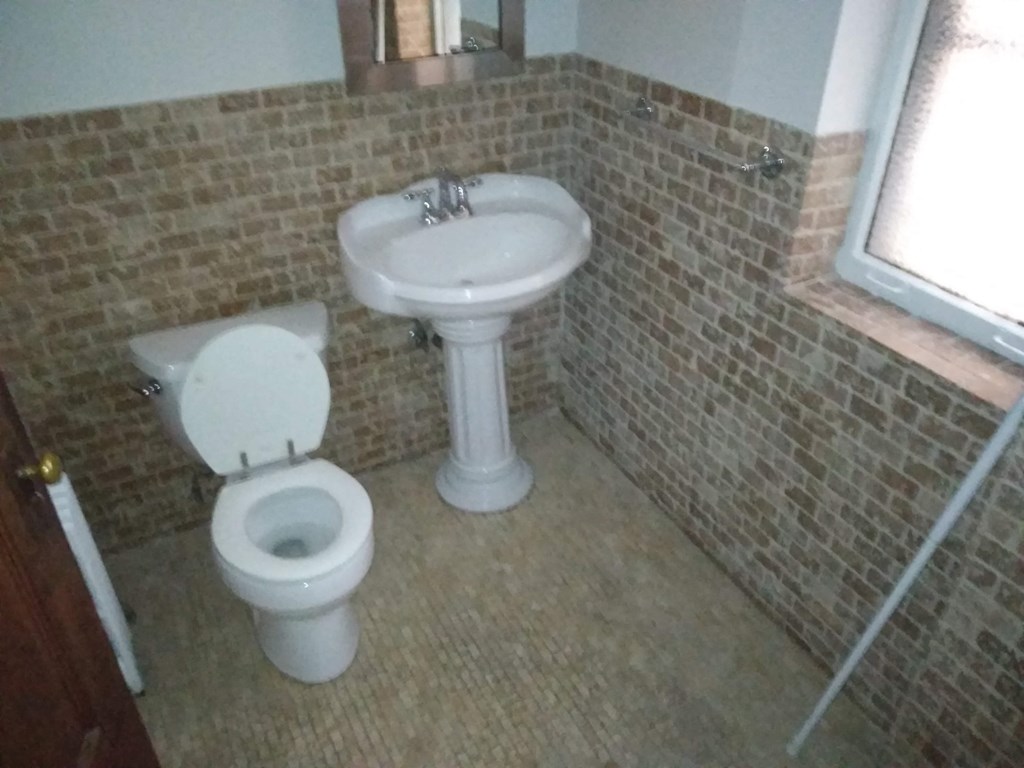 a small bathroom with a toilet and a sink
