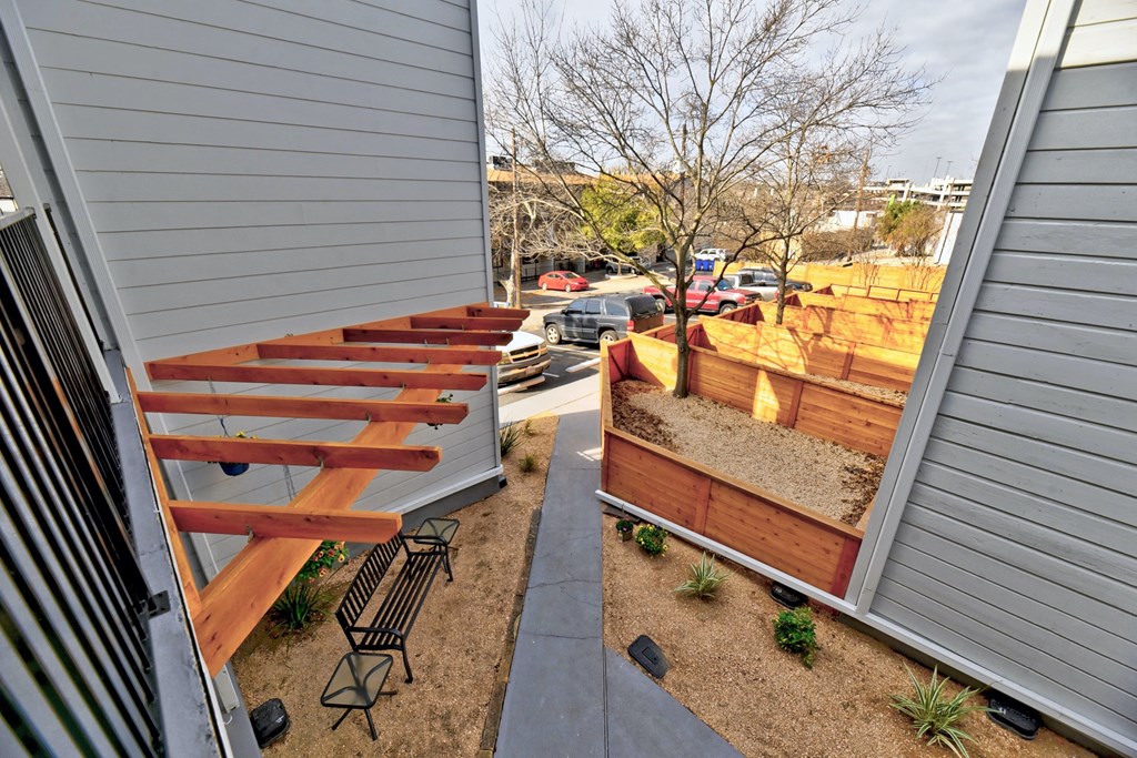 the stairs to the side of the house are made of wood