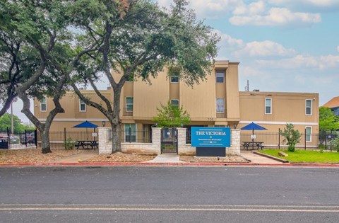 a building with a blue sign in front of it