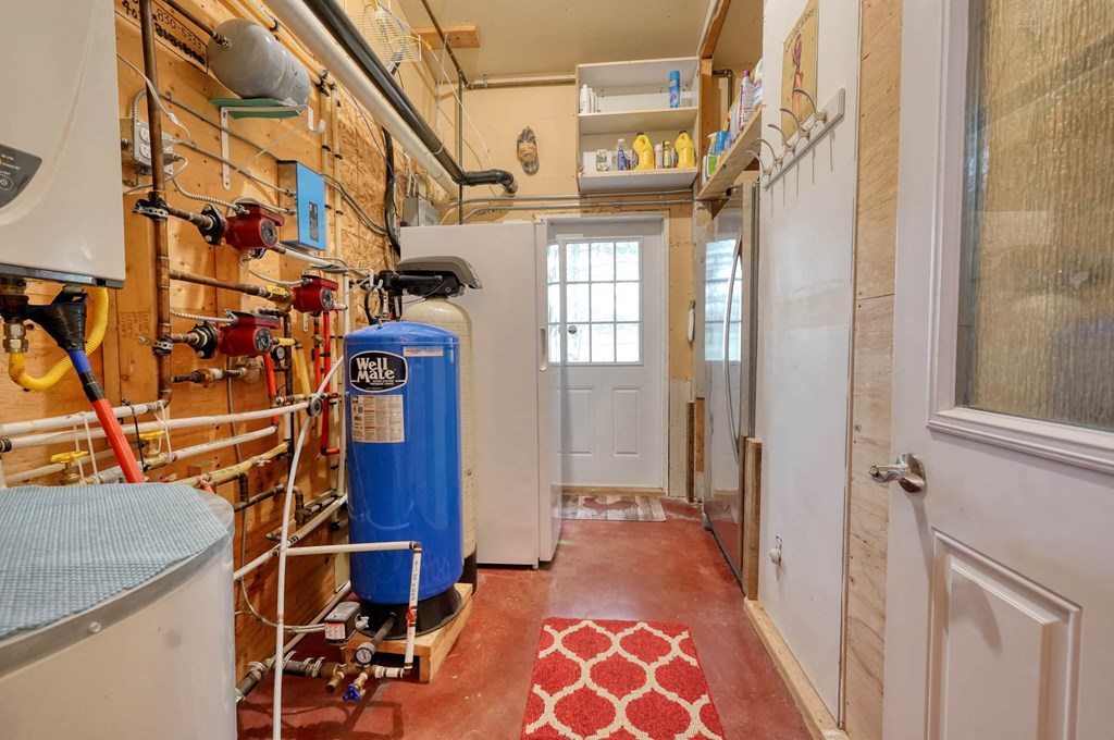 a small bathroom with a blue water heater in it
