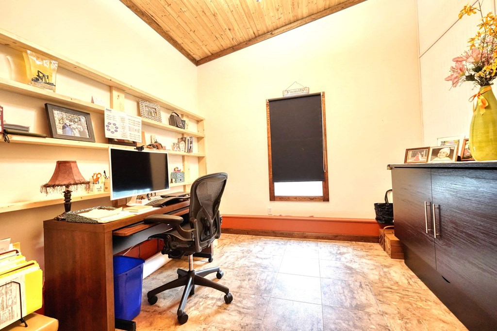 a home office with a desk and a computer