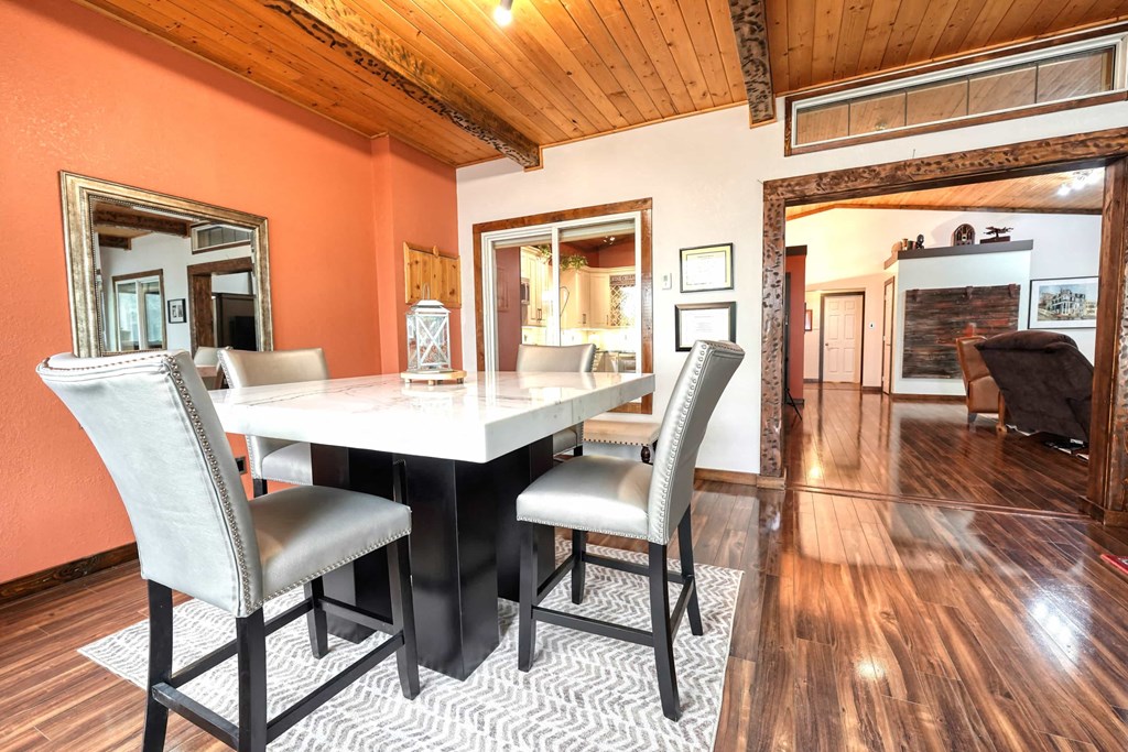 a dining room with a table and chairs