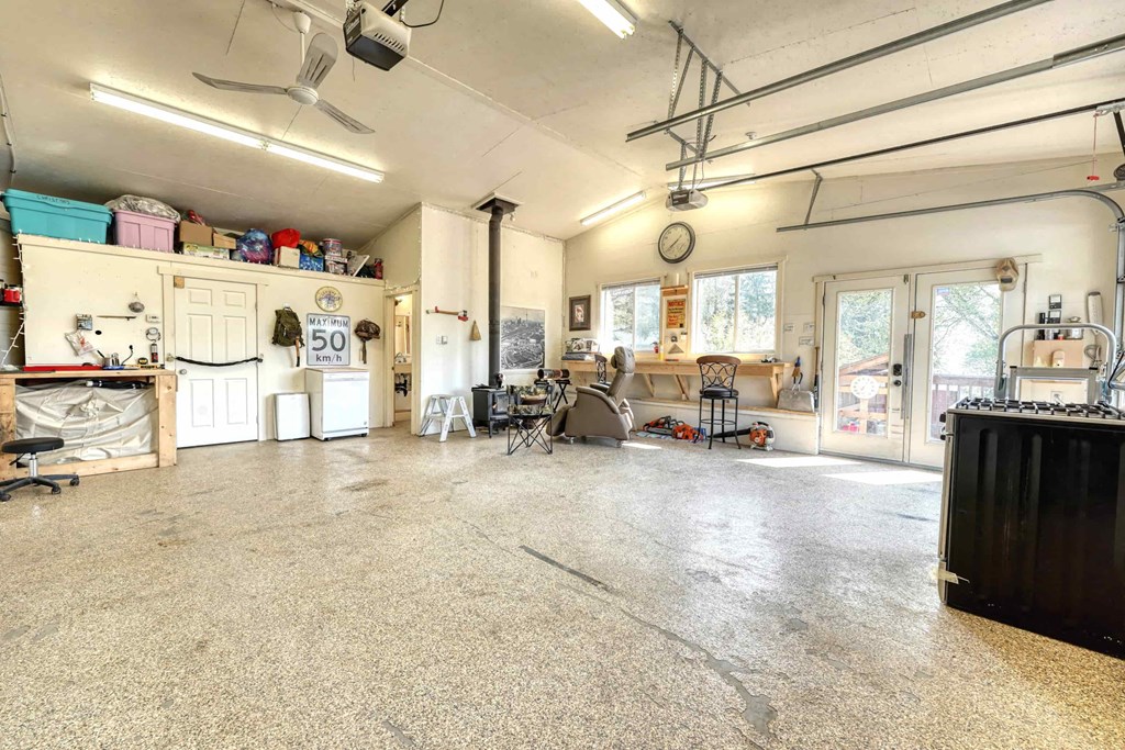 a large room with a concrete floor and appliances in it
