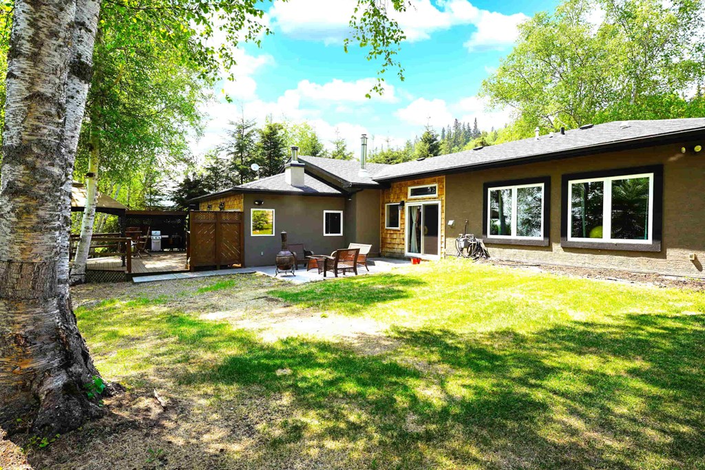 a view of the house from the back yard