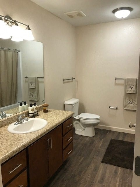a bathroom with a toilet and a sink and a mirror