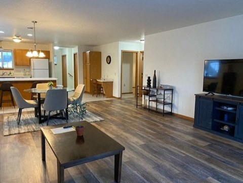 a living room with a table and a television