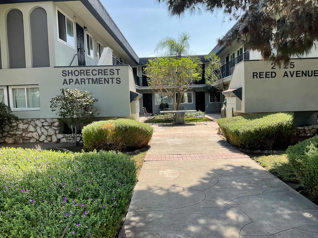 A building with the sign Shorecrest Apartments is seen.