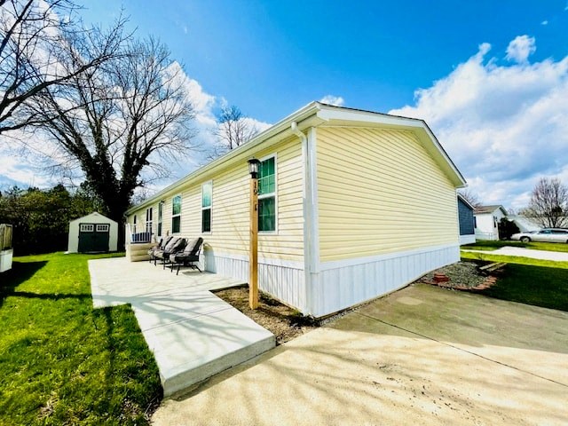 a small yellow house with a porch and a sidewalk