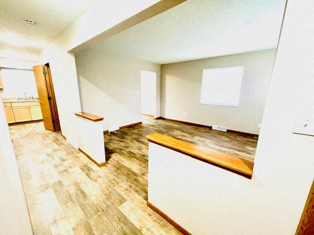 a large room with a wood floor and white walls