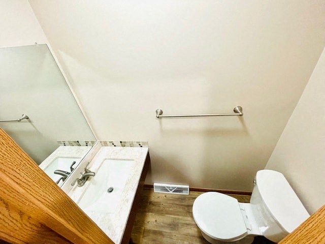 a bathroom with a toilet and a sink and a mirror