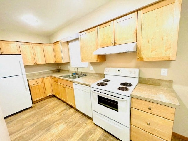 a kitchen with white appliances and wooden cabinets