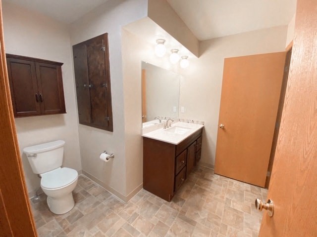a bathroom with a toilet and a sink