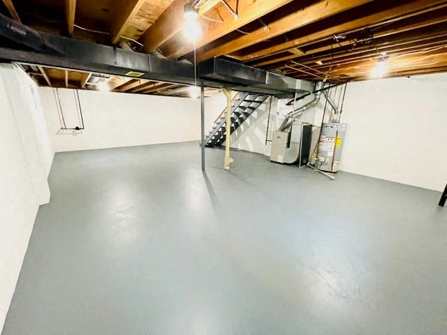 the basement of a house with a concrete floor