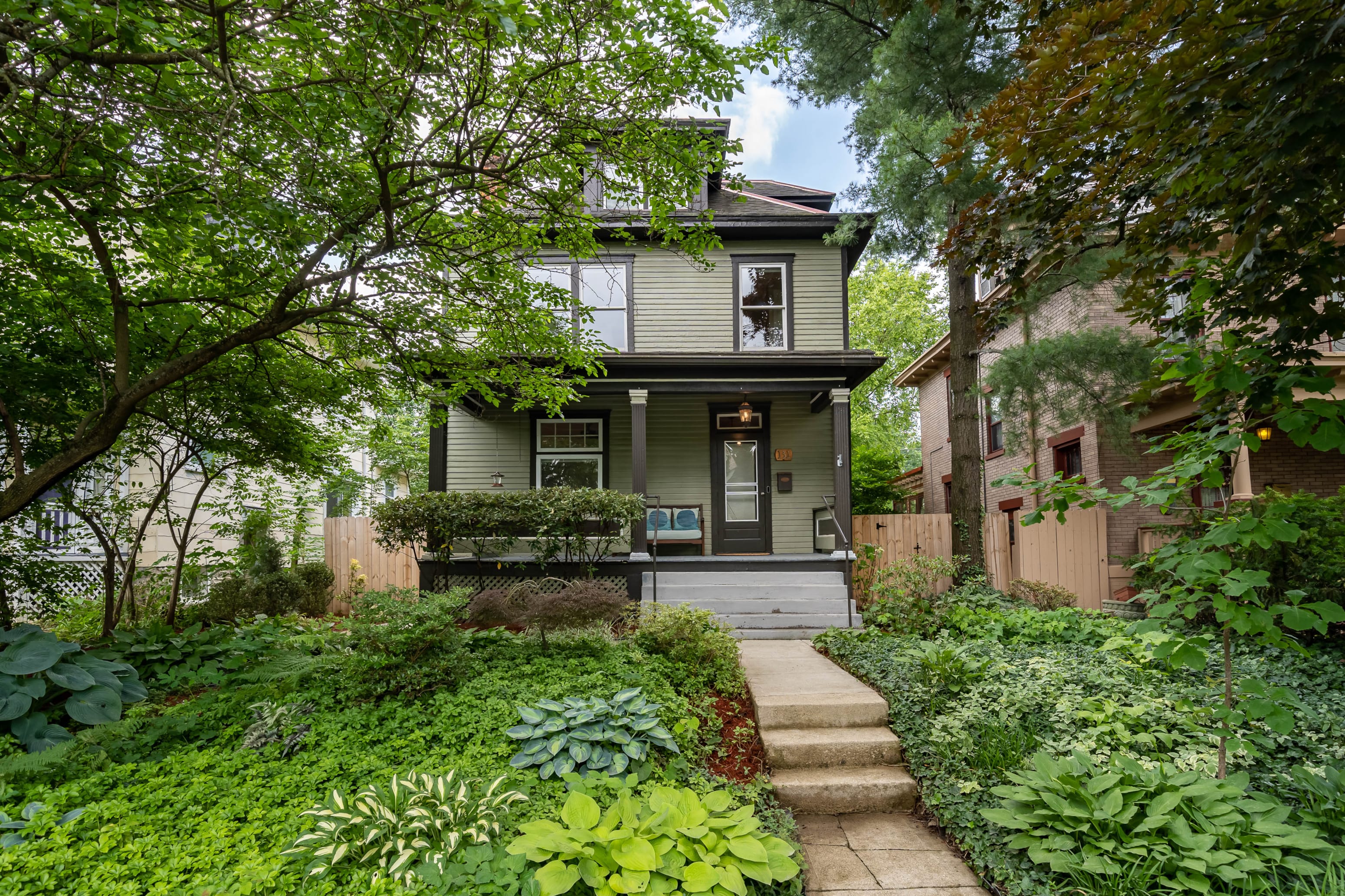 A house with a front yard and a small garden.