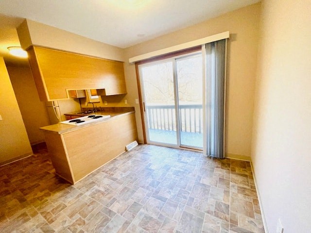 an empty living room with a sliding glass door