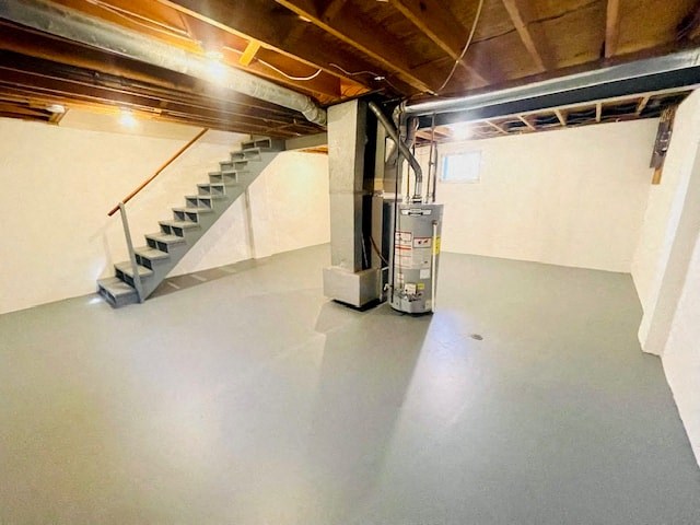 an empty garage with a staircase in the background
