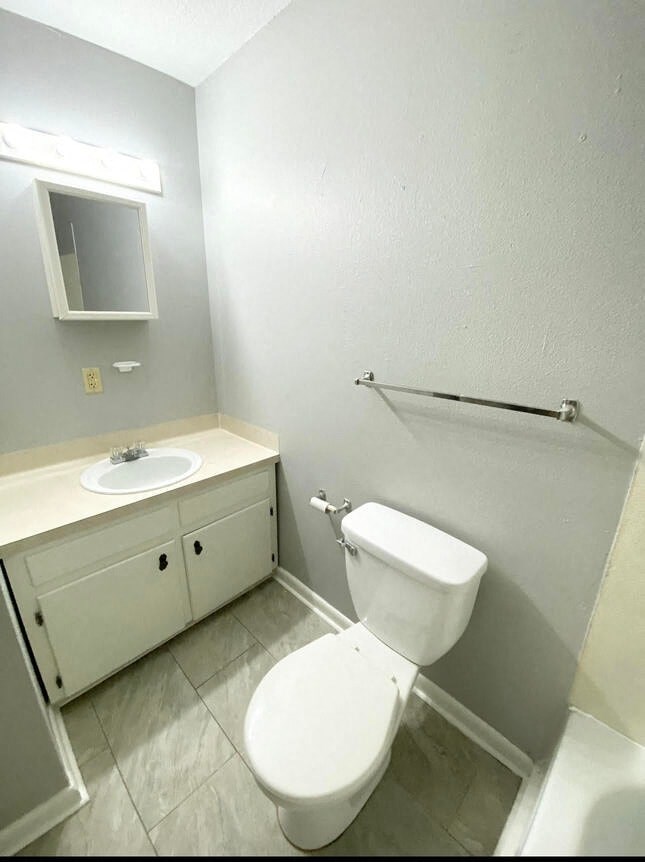 a bathroom with a toilet and a sink
