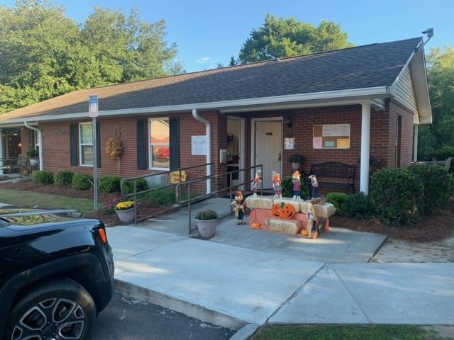 a house with a porch decorated with halloween decorations