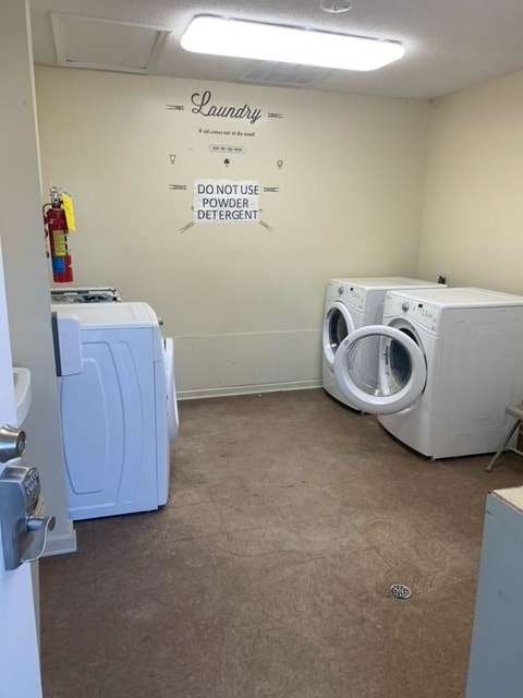 a laundry room with a washing machine and a dryer