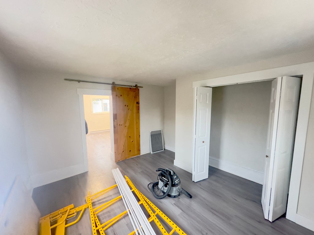 the living room and dining room are empty and ready for remodeling
