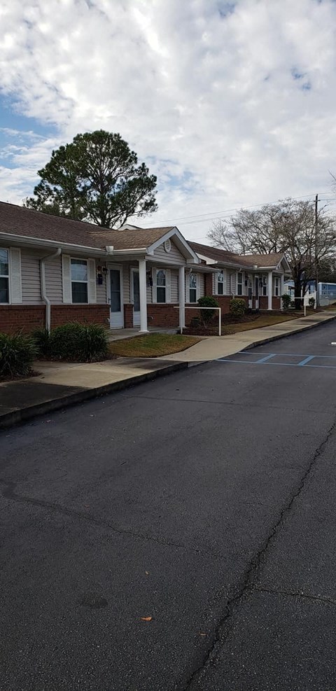 a row of houses on the side of a street